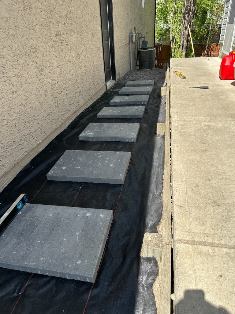 Filter fabric laid out along the side of the house