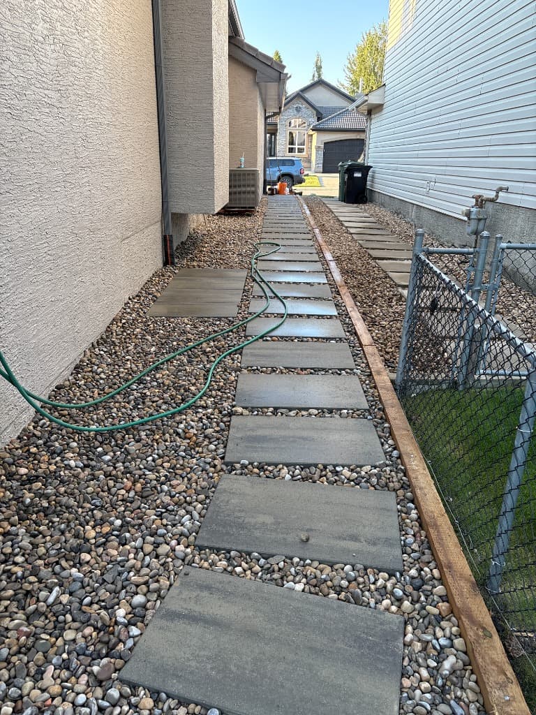 Full view of the new Techo-Bloc paver pathway and new wood property line border